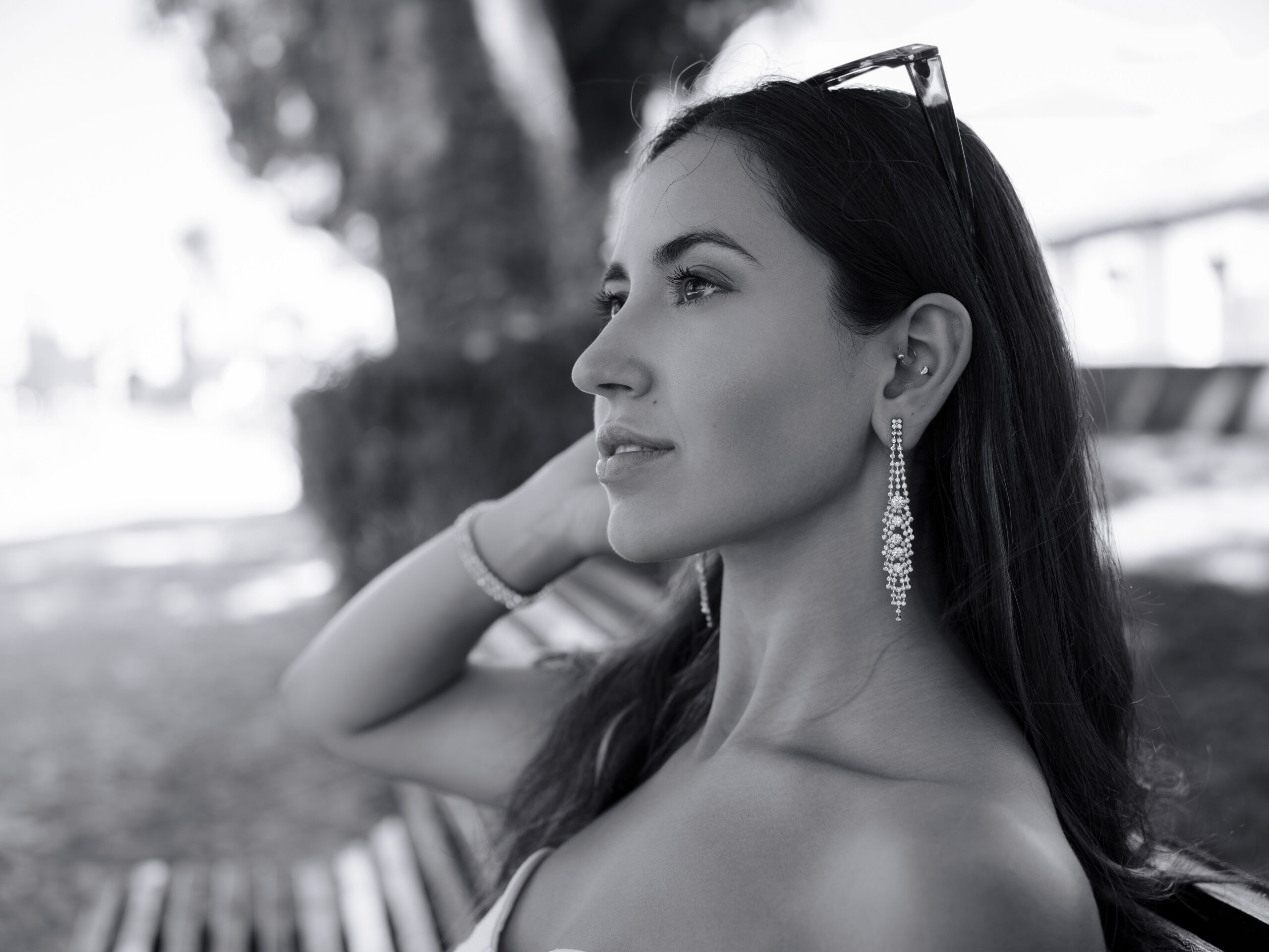 Stunning black and white portrait of a woman with accessories, captured outdoors in Lisbon.